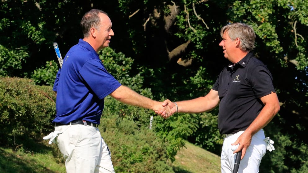 Gary Orr congratulates Barry Lane on the 18th green at Hanbury Manor