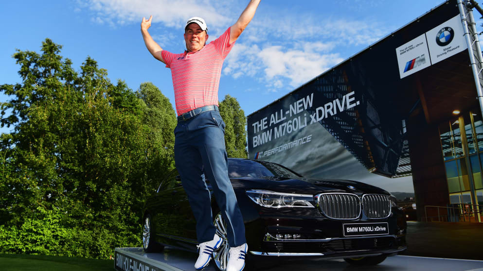 Richie Ramsay jumps for joy after he won a BMW M760Li for making a hole in one on the 16th