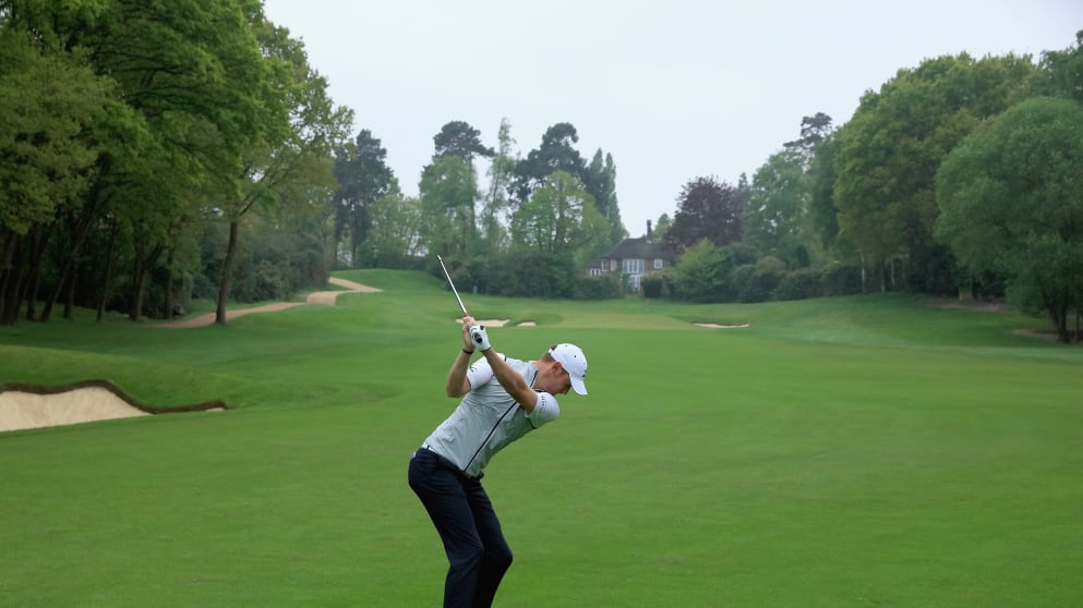 Chris Wood plays his second shot on the third hole