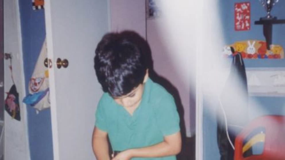A young Julian Suri practises in his bedroom