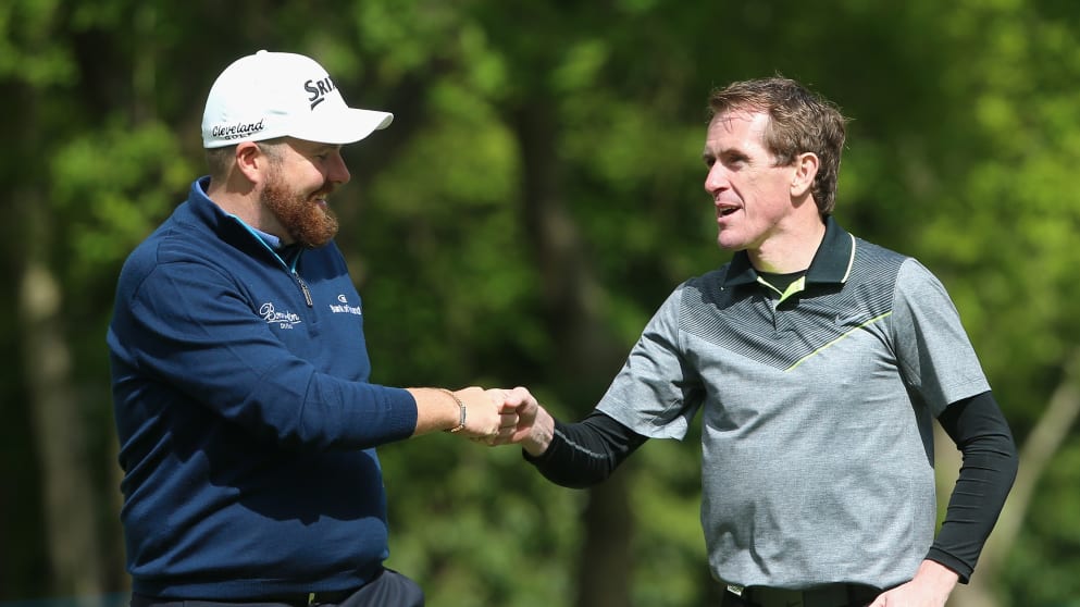Fomer jockey AP McCoy celebrates a shot with Shane Lowry 