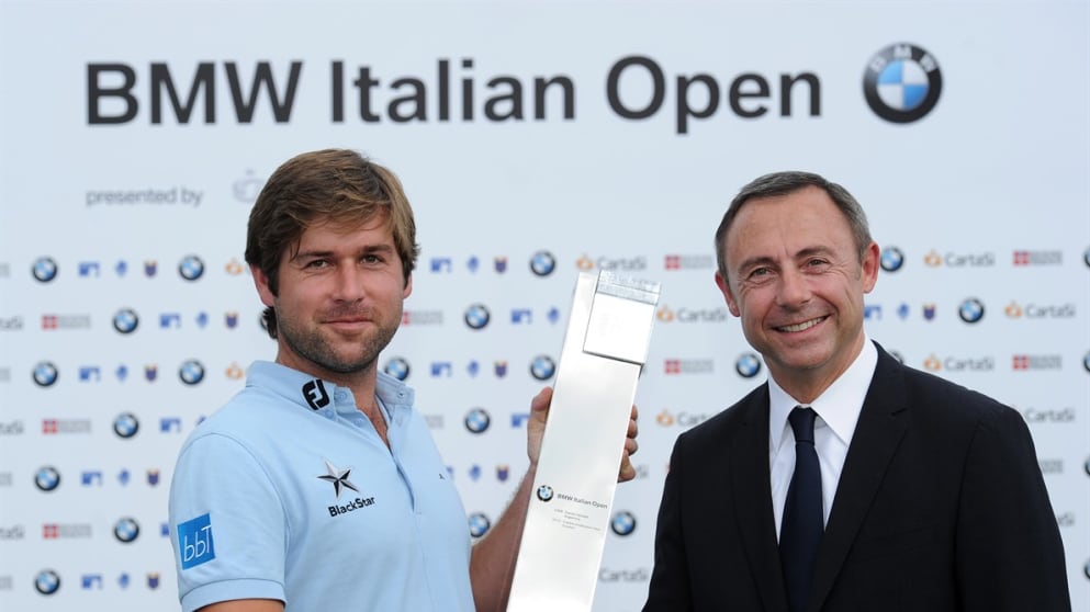  Robert Rock is presented with the trophy by Franz Jung, President of BMW Italy