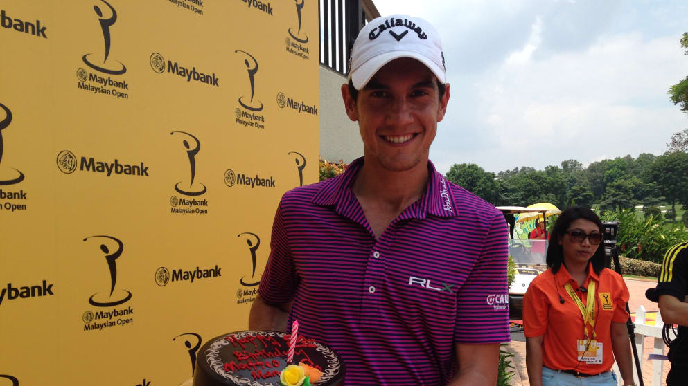 Matteo Manassero is given a cake to celebrate his 21st birthday