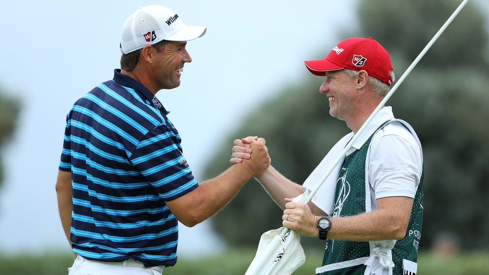 Padraig Harrington celebrates with his caddy