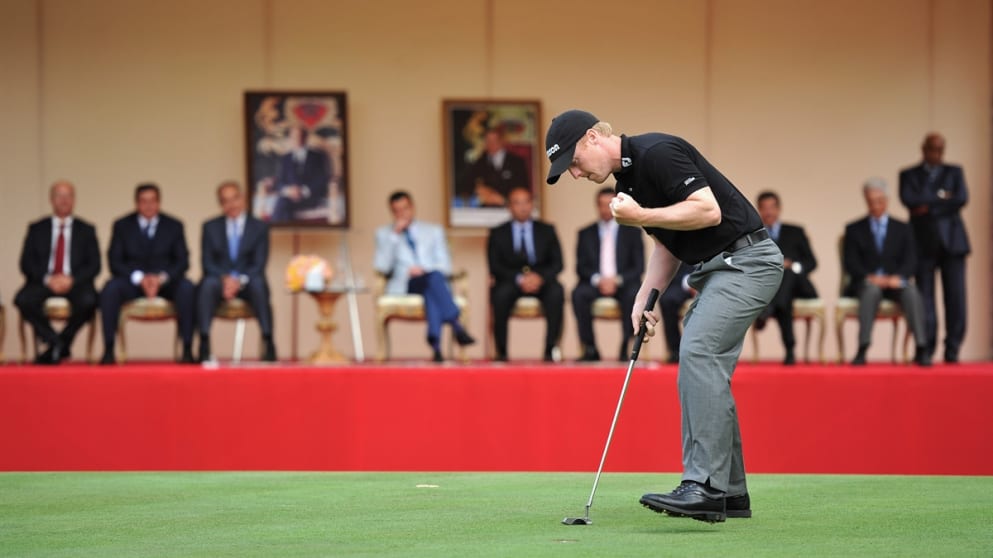 His Royal Highness Prince Moulay Rachid watches as David Horsey celebrates holing the winning putt