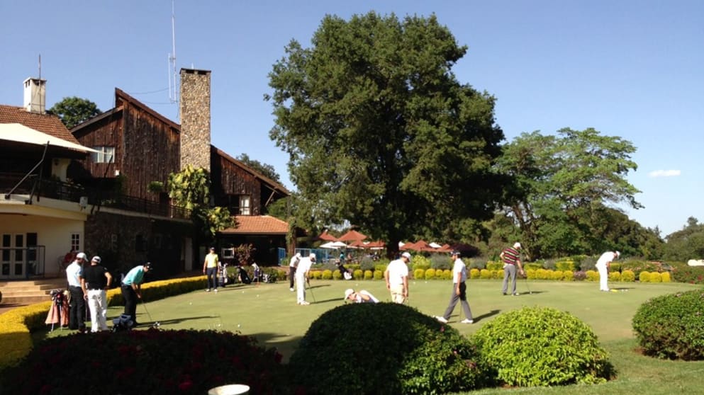The putting green and clubhouse at Karen Country Club