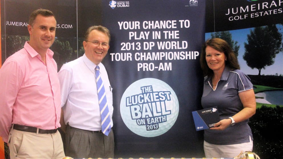 Maureen Platt, winner of the Luckiest Ball on Earth competition (right) with Neal Graham, Jumeirah Golf Estates, General Manager - Club Operations (left) and Nick Tarratt, European Tour International Director, Dubai Office