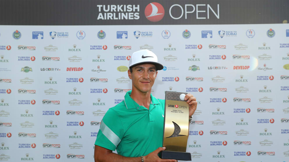 Thorbjorn Olesen poses with the trophy