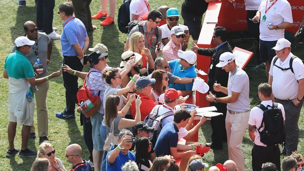 Dustin Johnson signs autographs in Abu Dhabi