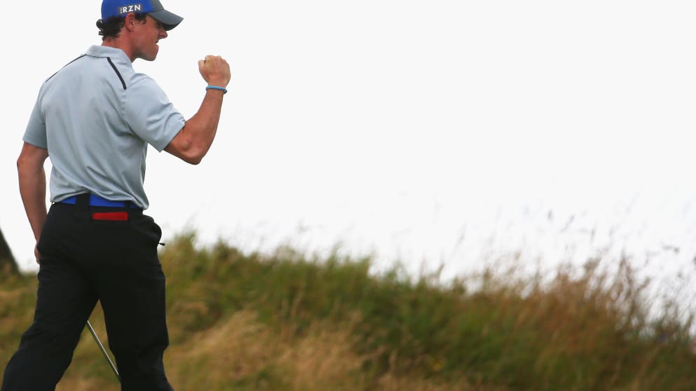 Rory McIlroy celebrates his birdie putt on the 14th