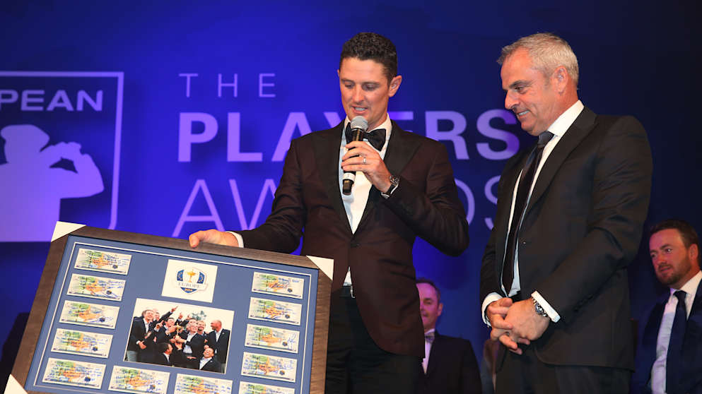 Paul McGinley receives a gift from the European Ryder Cup players