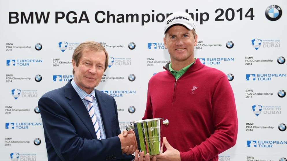 Robert Karlsson is presented with a silver ice bucket by George in recognition of his 500th appearance on The European Tour