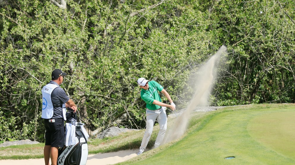 Justin Rose - plays a bunker shot on the second hole during the first round of the WGC - Dell Match Play at the Austin Country Club