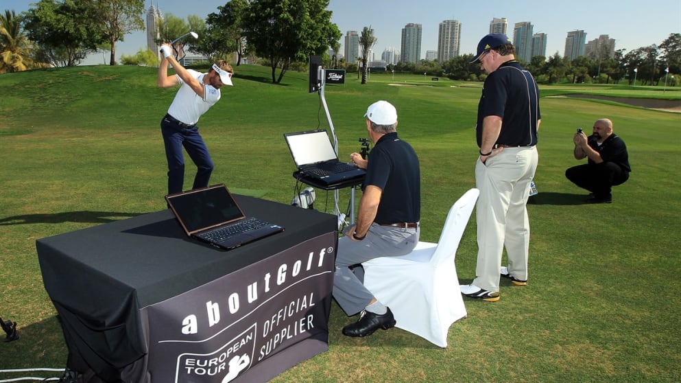 Raphael Jacquelin under the watchful eye of biomechanist Jean Jacques Rivet and aboutGolf's Chuck Faust