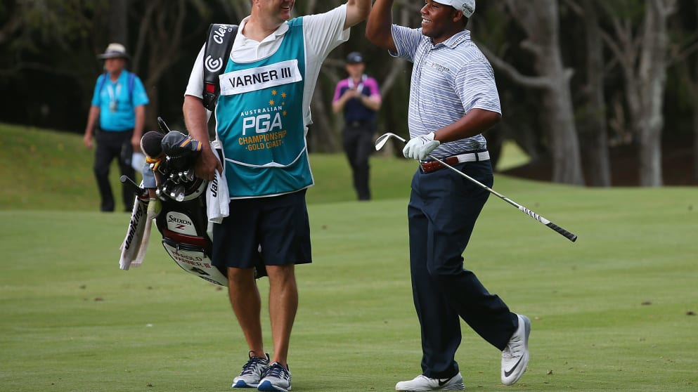 Harold Varner III high fives his caddie