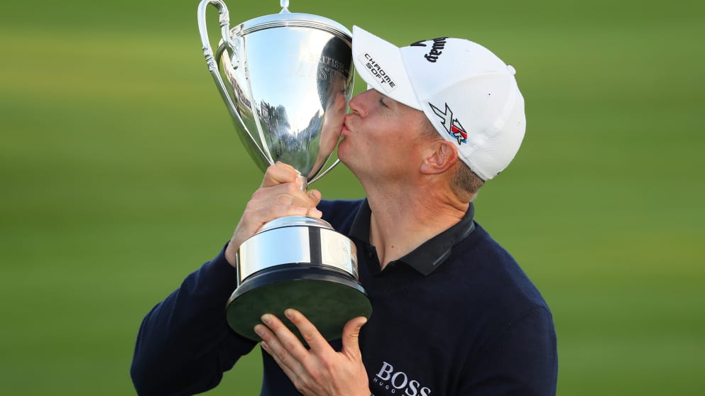 British Masters Champion Alex Noren kisses the trophy 