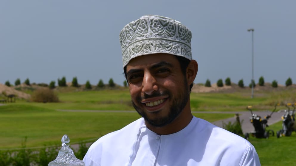 Azaan Al Rumhy proudly holds the trophy after winning the inaugural Black Tee Challenge at Almouj Golf The Wave, Muscat in May