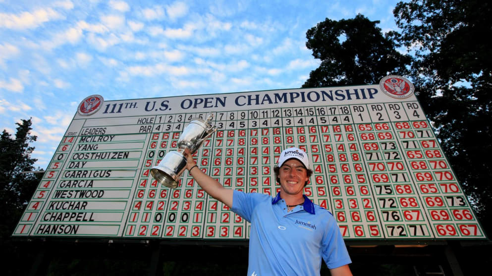 Rory McIlroy holds the US Open trophy aloft