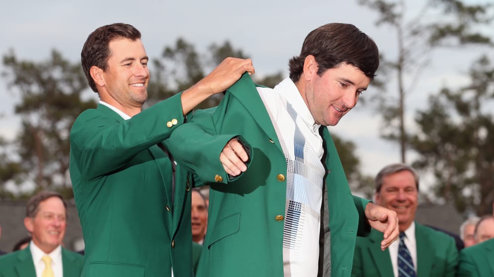 Adam Scott presents Bubba Watson with the green jacket 