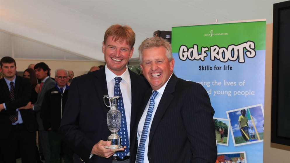 Ernie Els receives the Golf Foundation Spirit of Golf Award from Colin Montgomerie