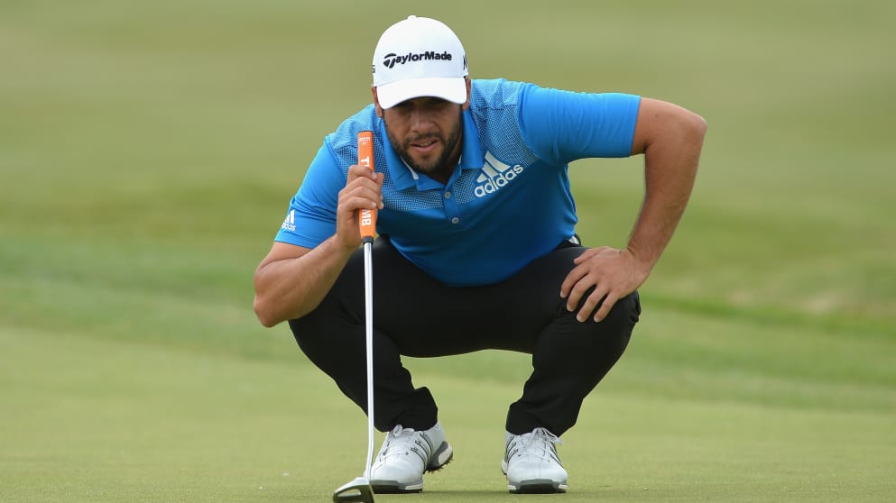 Adrian Otaegui lines up a putt during his round of 64
