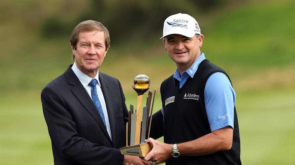 Paul Lawrie  with the winners trophy from George O'Grady