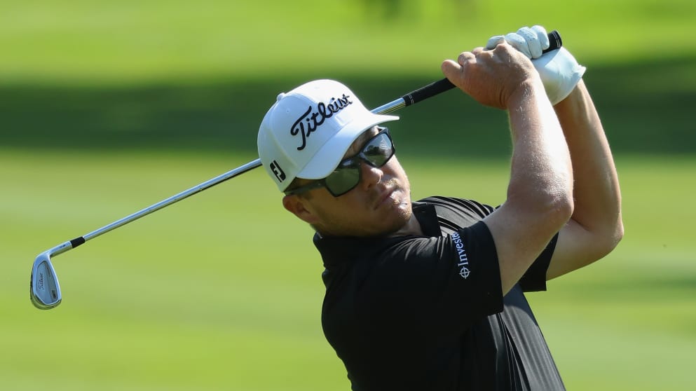 George Coetzee of South Africa plays his second shot into the 15th green 