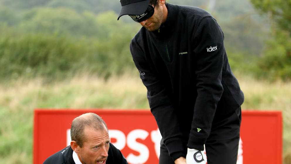 Gregory Bourdy gets some tips from Craig Thomas in a Blind & Disabled Golf Clinic at the ISPS Handa Wales Open 