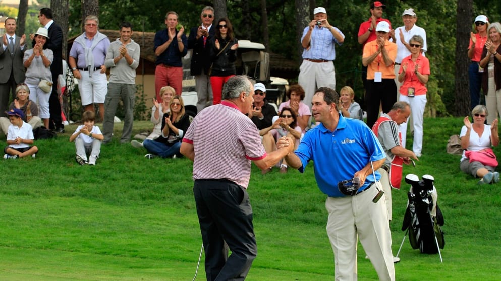 David J Russell of England is congratulated by Tim Thelen