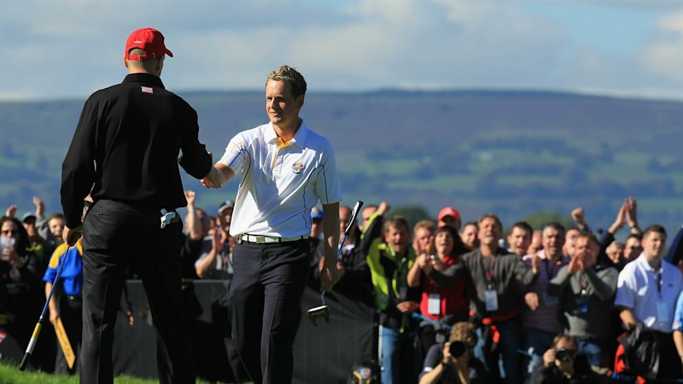 Luke Donald is congratulated by Jim Furyk