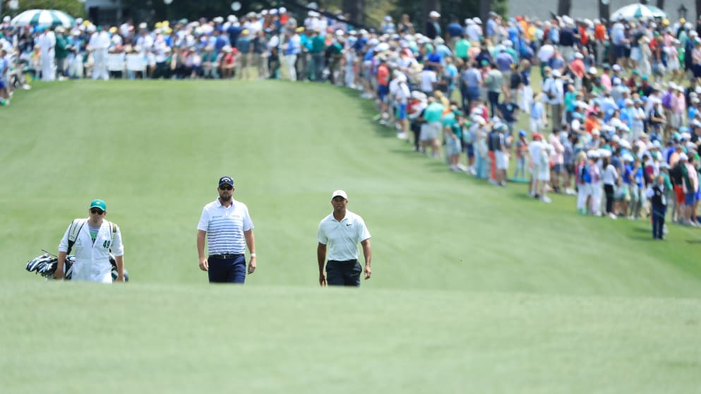 Marc Leishman of Australia and Tiger Woods 