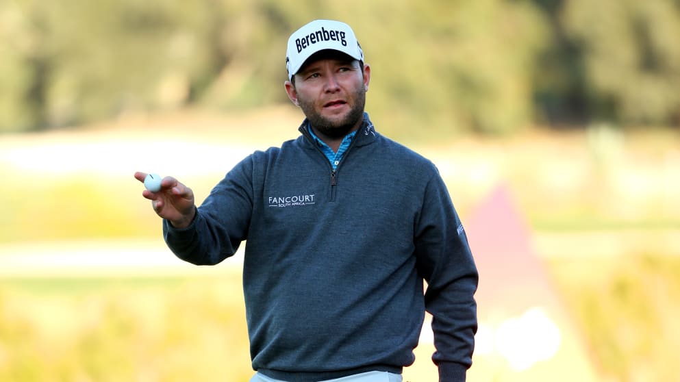 Branden Grace - acknowledges the crowd after signing for a 68 in Qatar on moving day