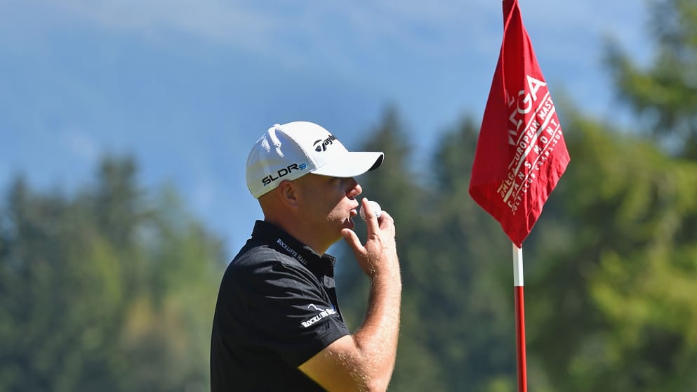 Graeme Storm - kisses his golf ball after making a hole in one on the 11th hole during the third round of the Omega European Masters