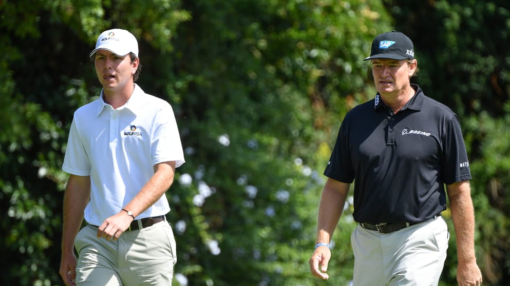Ernie Els of South Africa walks with his nephew Joyan Rebula
