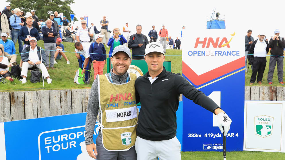 Alex Noren and his caddie with gold caddie bib reserved only for Rolex Series winners