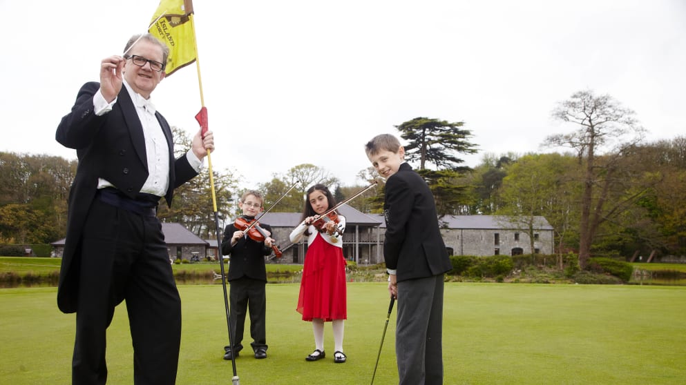 Conductor Keith Pascoe joins Killian Murphy (8), Katie Murphy (9) and Darragh Murphy (11) launch the Irish Open / Il Divo ticket promotion at  Fota Island Resort