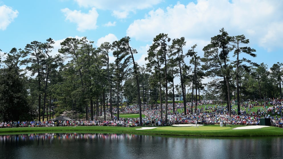 Patrons watch the play during the Par 3 Contest prior to the start of the 2015 Masters Tournament 