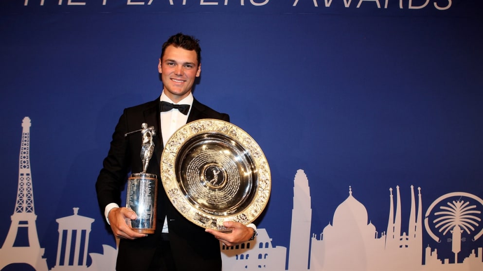Martin Kaymer of Germany poses with the Harry Vardon Trophy and Players' Player award