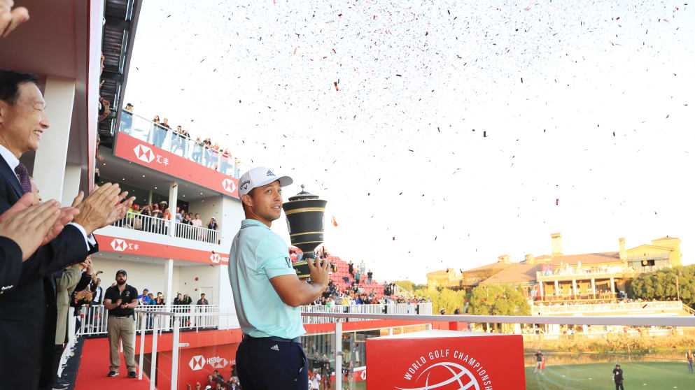 Xander Schauffele lifts the trophy in China