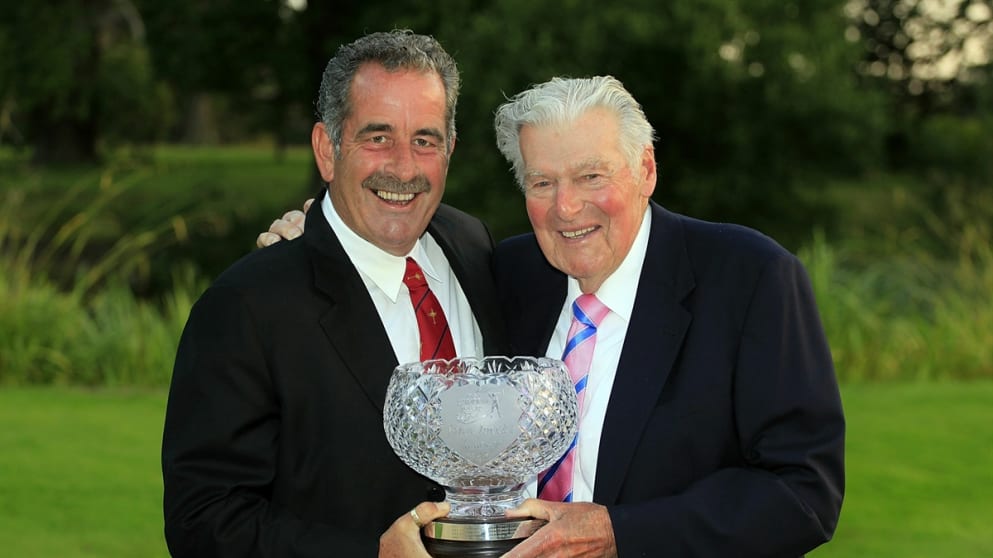 Sam Torrance receives the John Jacobs Trophy from John Jacobs