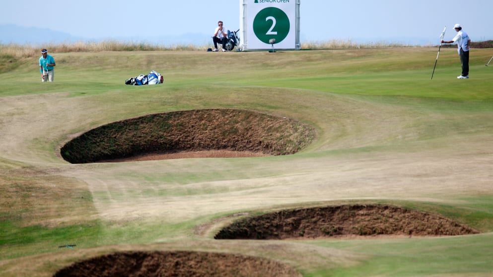 The fiery links of Royal Porthcawl has provided a stern test for the Senior Open Championship's world-class field in Wales