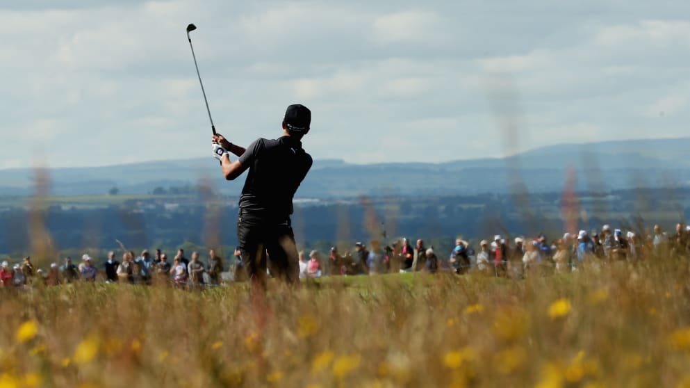 Rickie Fowler of the United States watches his approach shot on the ninth hole