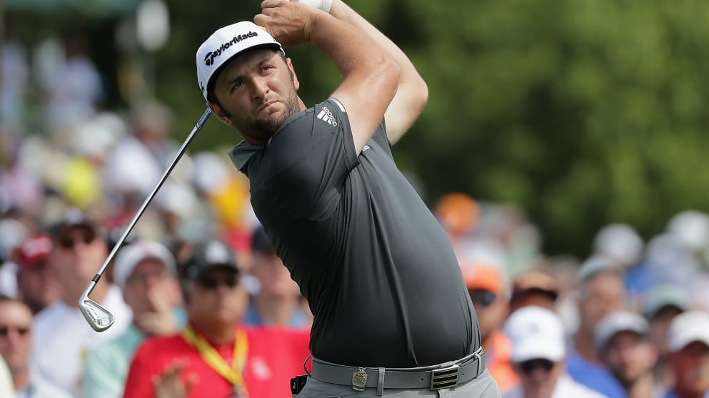 Jon Rahm of Spain plays his shot from the sixth tee