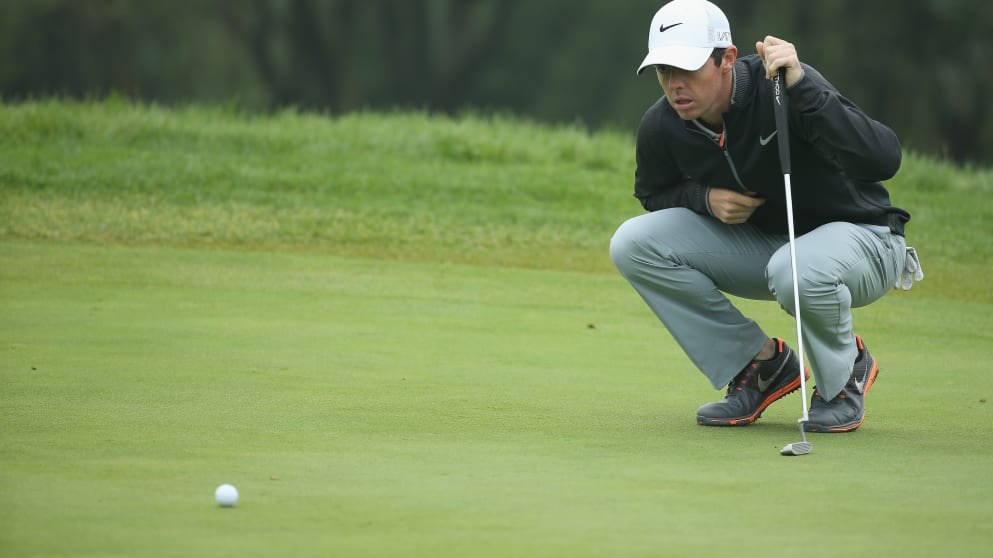 Rory McIlroy lines up a putt