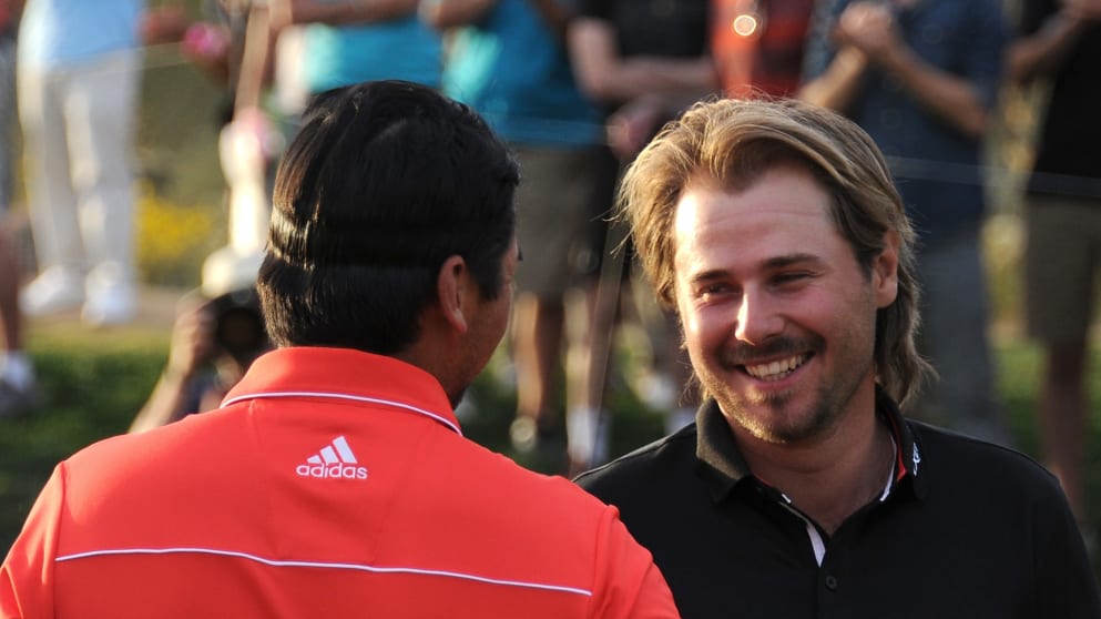 Victor Dubuisson congratulates Jason Day