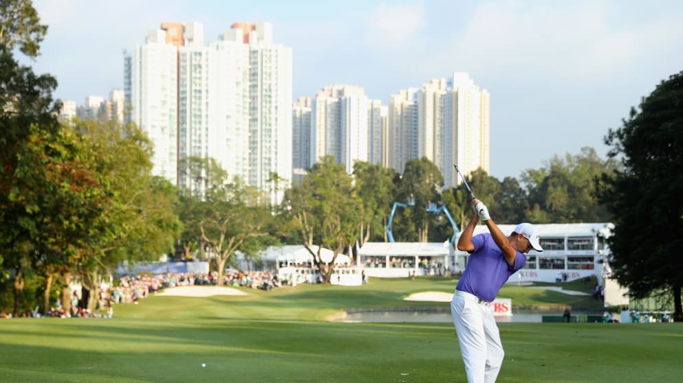 Sam Brazel plays his approach shot to the 18th green at Hong Kong GC