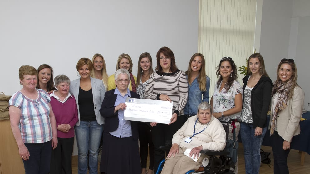 Karen Horne (centre right) presents the cheque from the Pro-Am donations to Sr Zoe Killeen of RESPECT Ireland