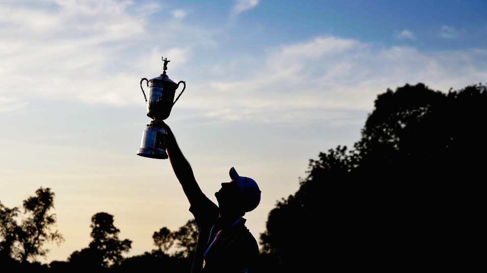 Justin Rose lifts the US Open trophy in 2013