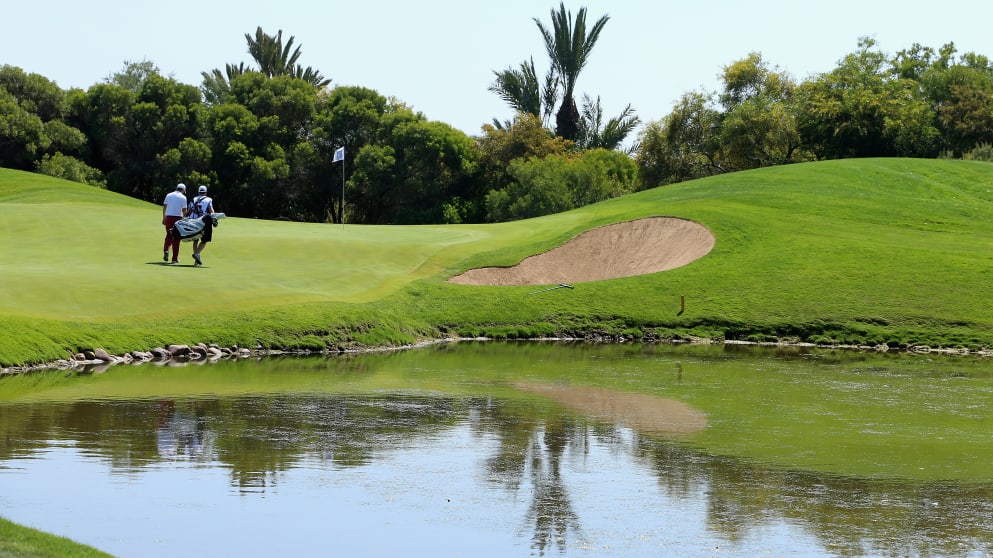 Richie Ramsay walks with his caddie on the fifth hole during the third round of the Trophee Hassan II