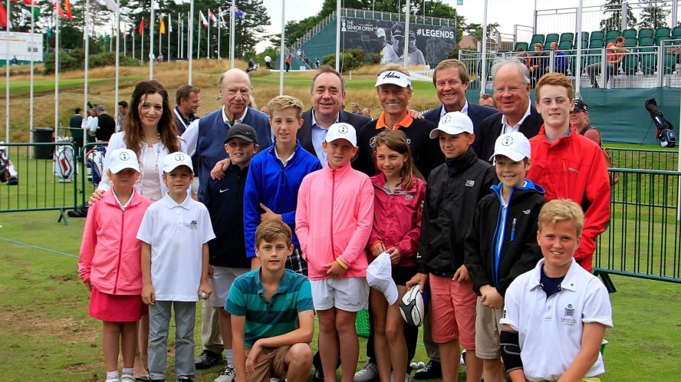 Bernhard Langer, dignitaries and children who attended the clinic at the Senior Open pose for a photo